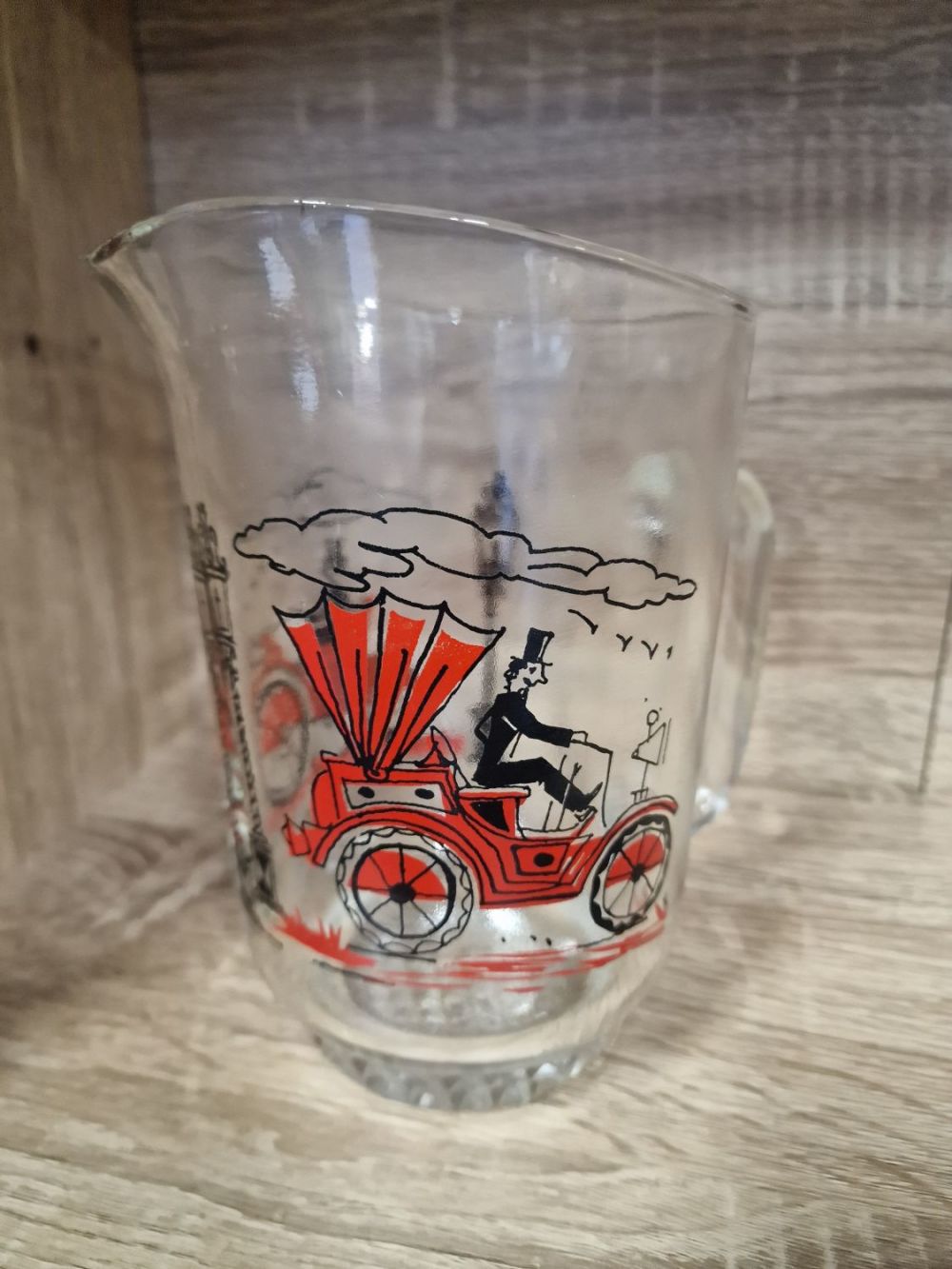Lot 312: Vintage motor car pitcher / jug