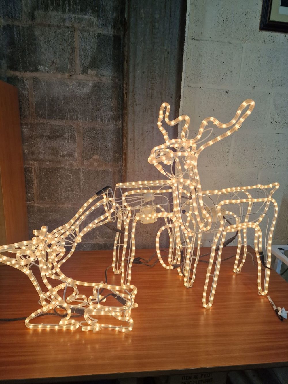 Lot 418: Three animated reindeer - light up and move...
