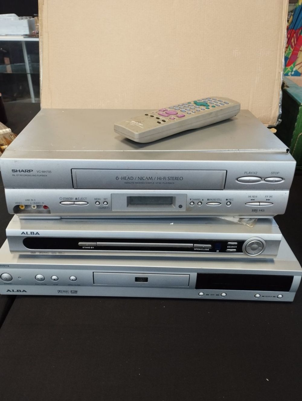 Lot 203: Two Alba DVD Players and a Sharp VCR