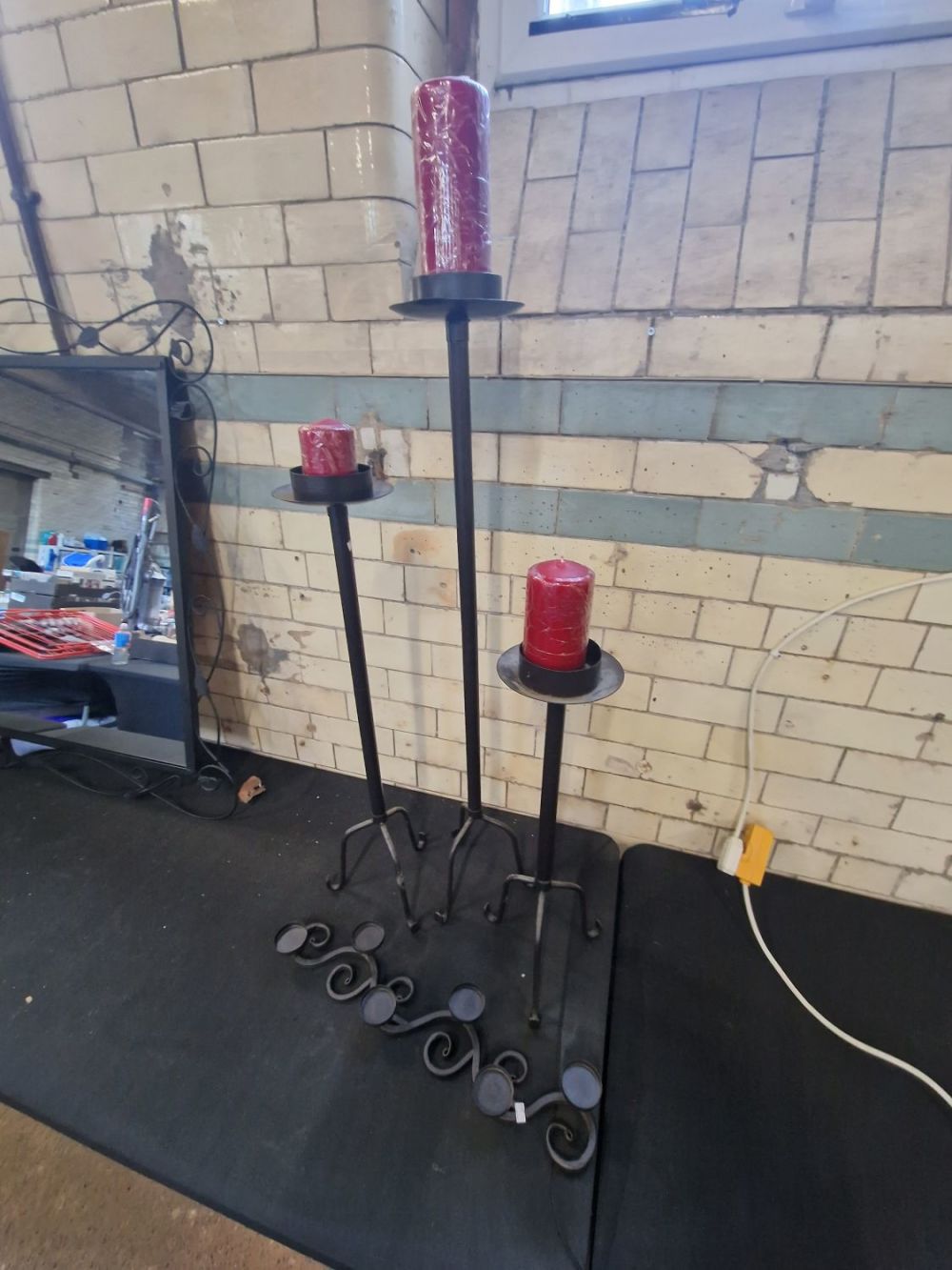 Lot 249: A Three piece set of Cast metal candle...