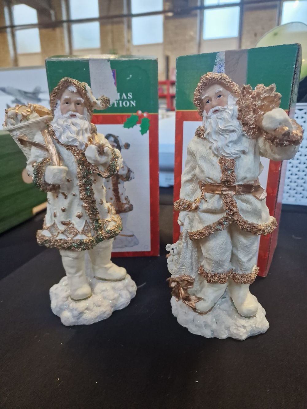 Lot 268: A pair of cream and gold Father Christmas...