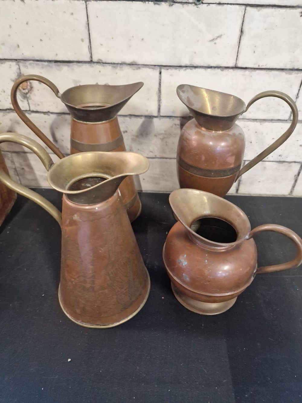 Lot 307: Four copper vintage jugs