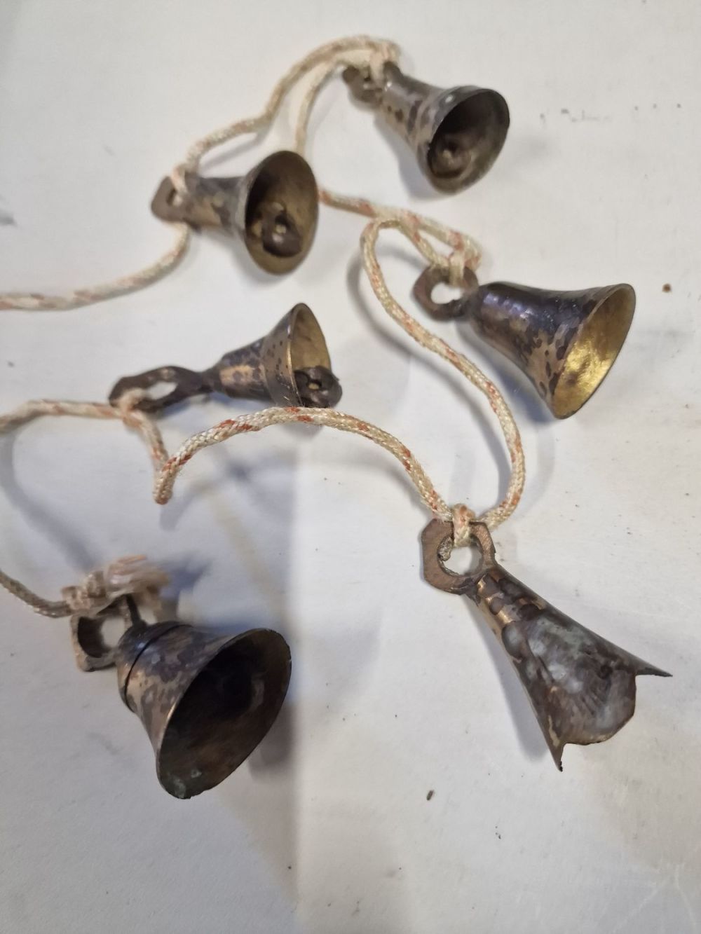 Lot 355: Six vintage brass bells.