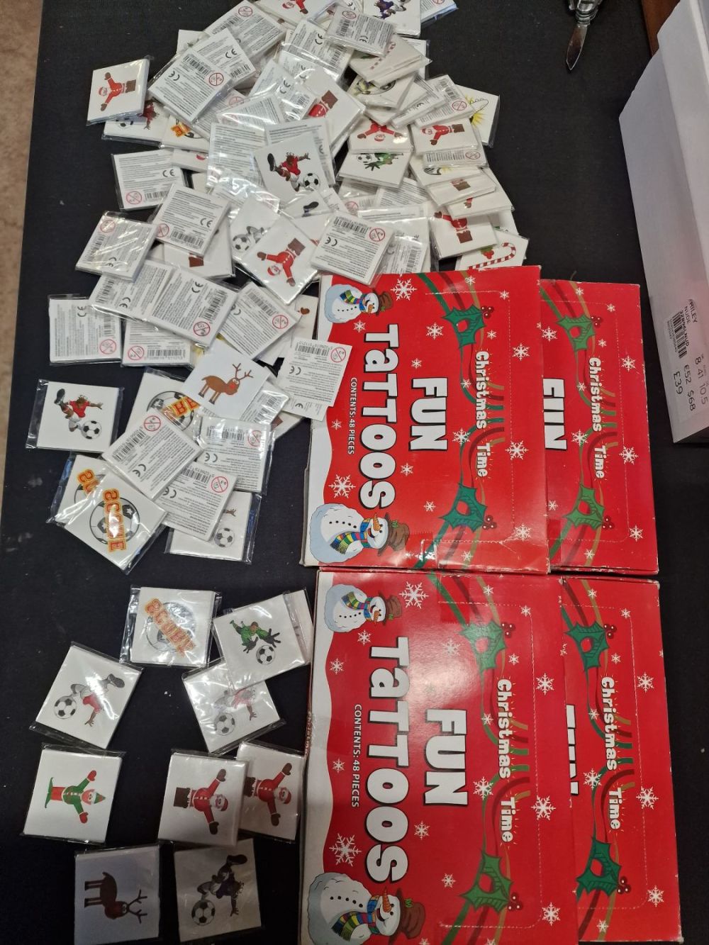 Lot 410: 96 packs of brand new Christmas fun tattoos...