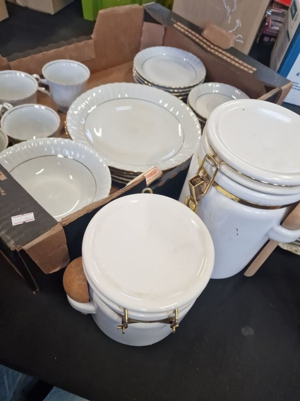 Lot 177: A collection of white and gold pottery, plates,...
