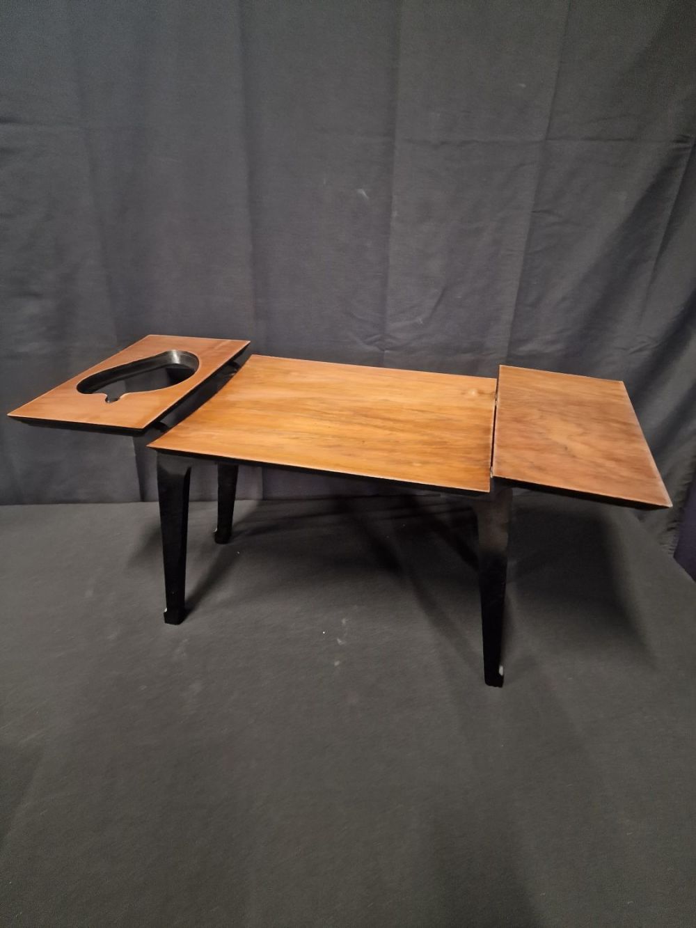 Lot 109: A unique 1970's side table. With drop centre...