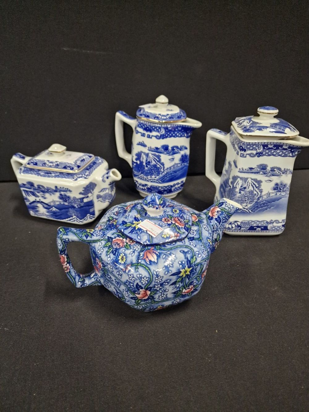 Lot 115: Four vintage Ringtons tea tops. Three oriental will...