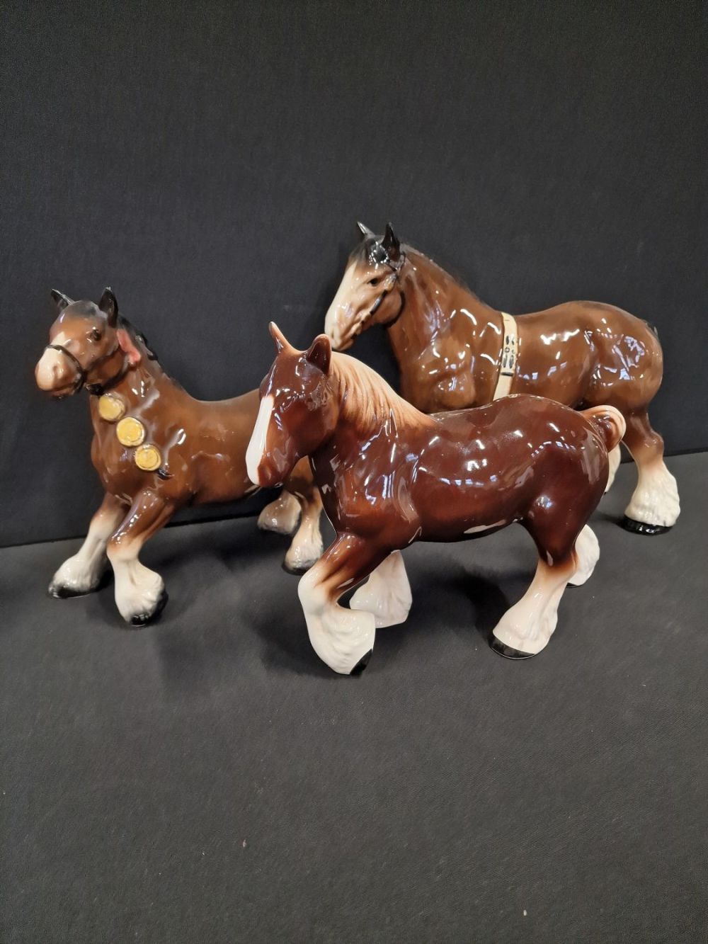 Lot 116: Three Beswick style hand painted Shire horses