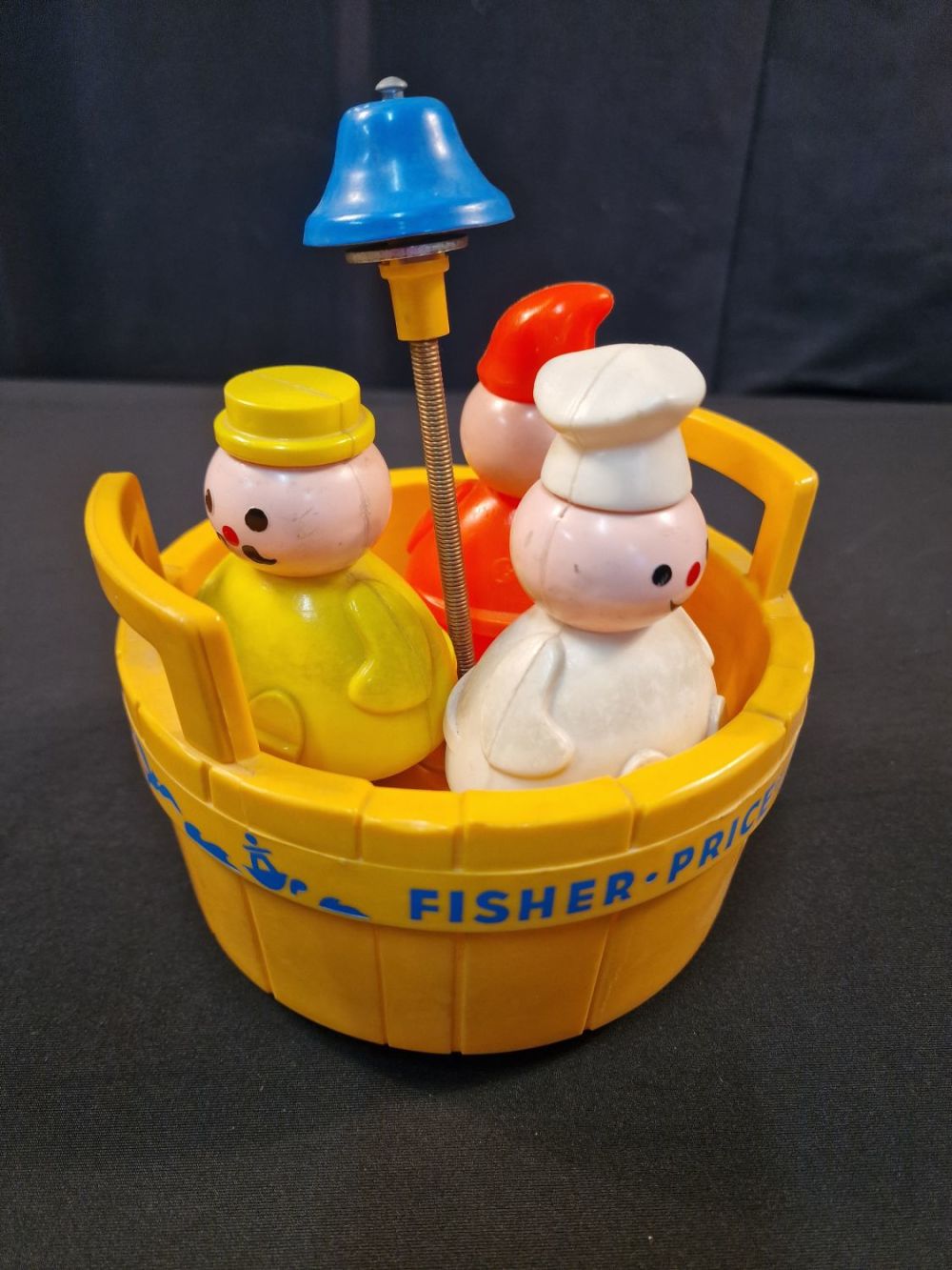 Lot 120: A vintage Fisher Price 3 men in a...