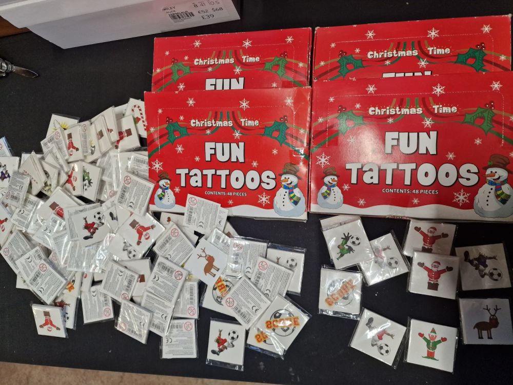 Lot 199: 96 packs of brand new Christmas fun tattoos...