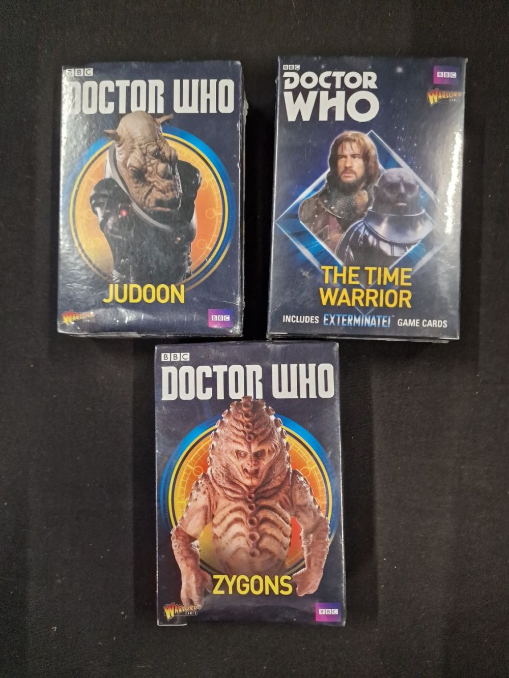 Lot 222: Three sealed Warlord Doctor Who packs of figures....