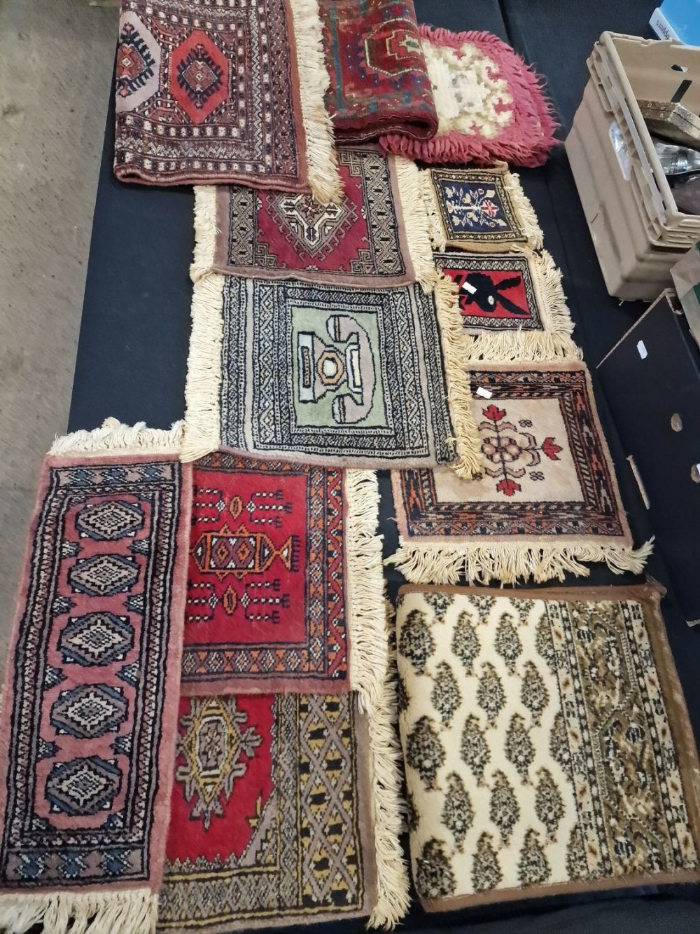 Lot 254: Collection of mixed sized hand woven, woolen tiles...