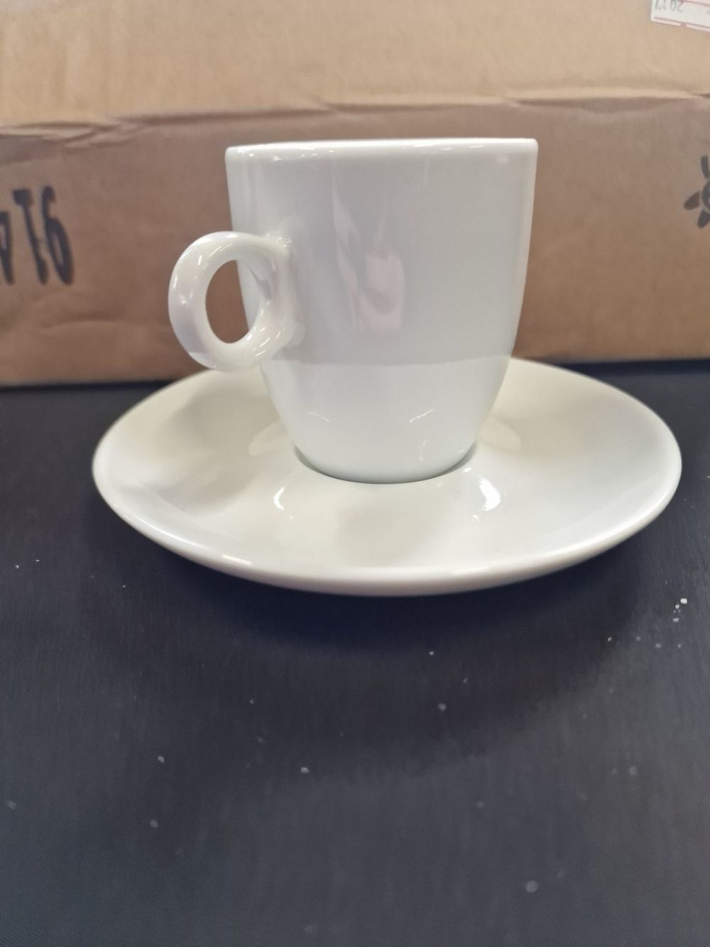 Lot 258: A set of six white espresso cups and...
