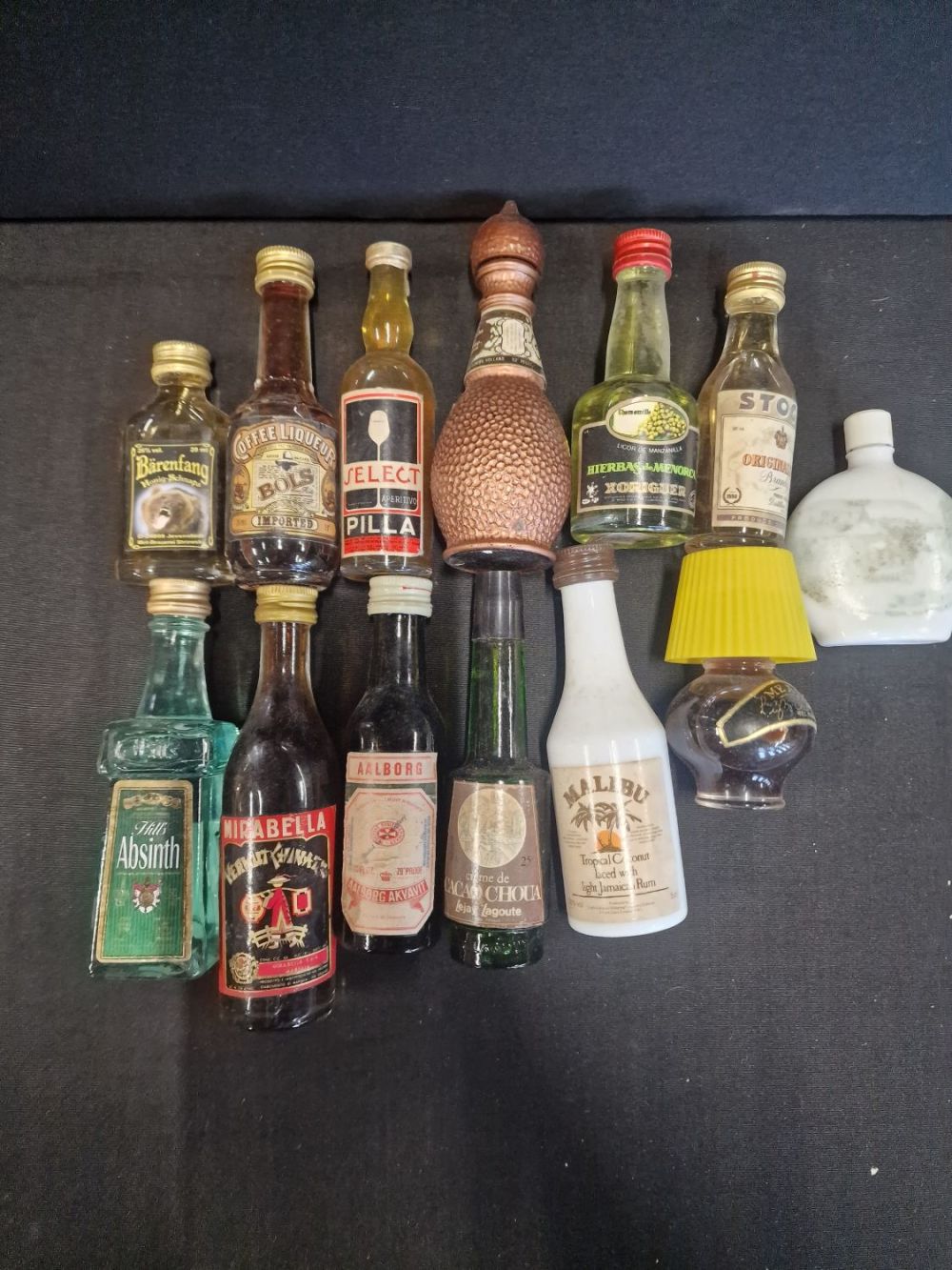Lot 294: A quantity of 13 vintage miniature alcohol bottles....