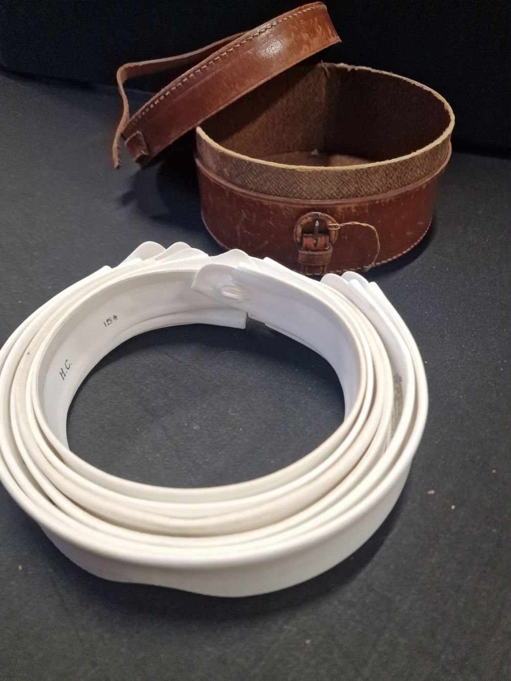 Lot 311: A vintage leather bound collar case with six...