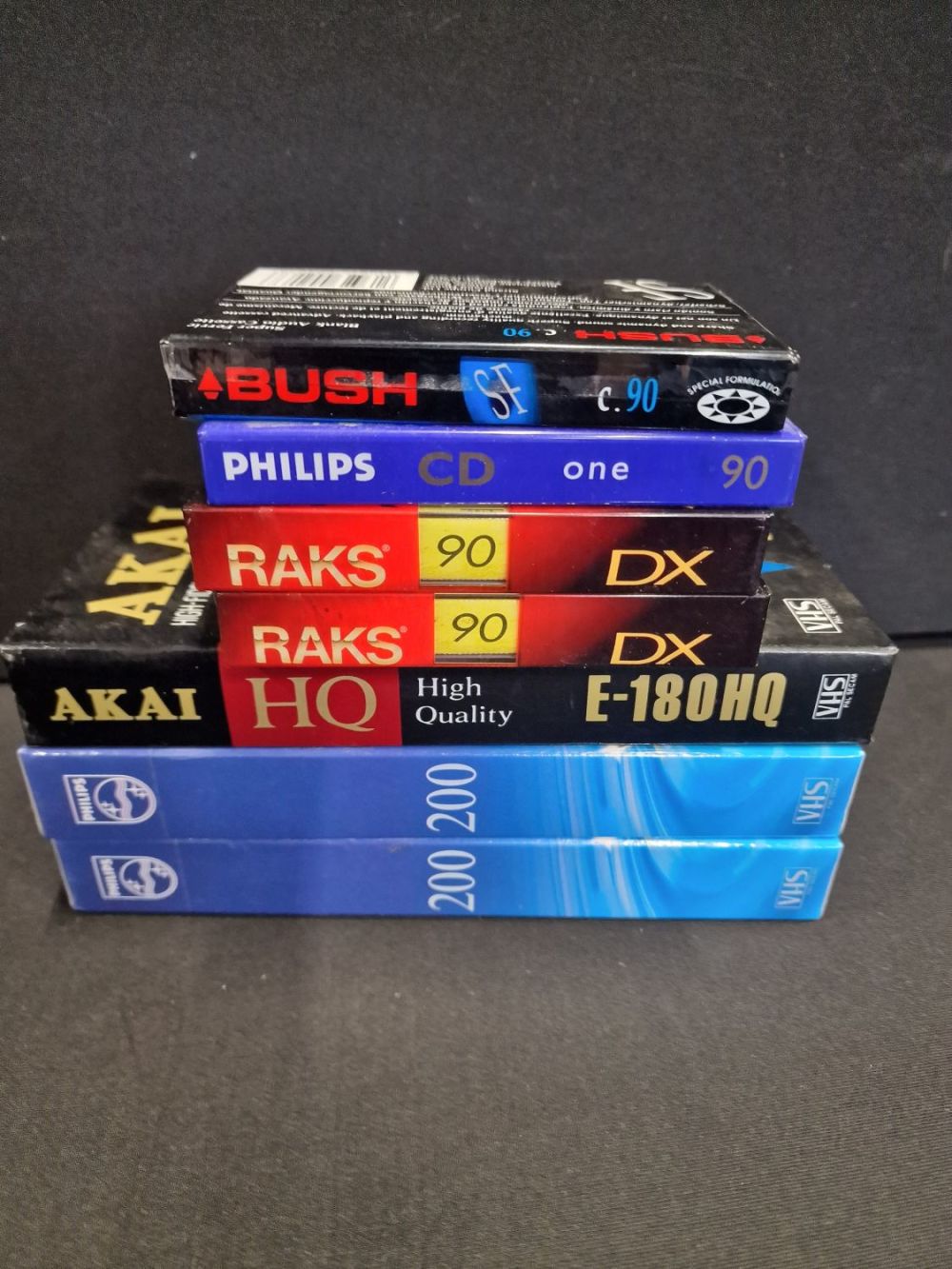Lot 318: Four brand new cassette tapes, RAKS, BUSH and...