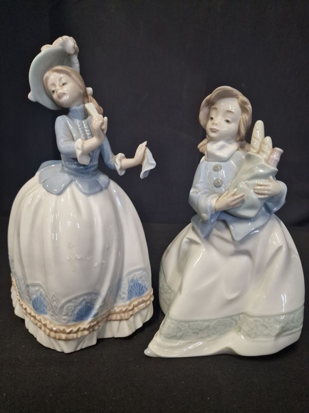 Lot 354: Two Nao by Lladro figurines