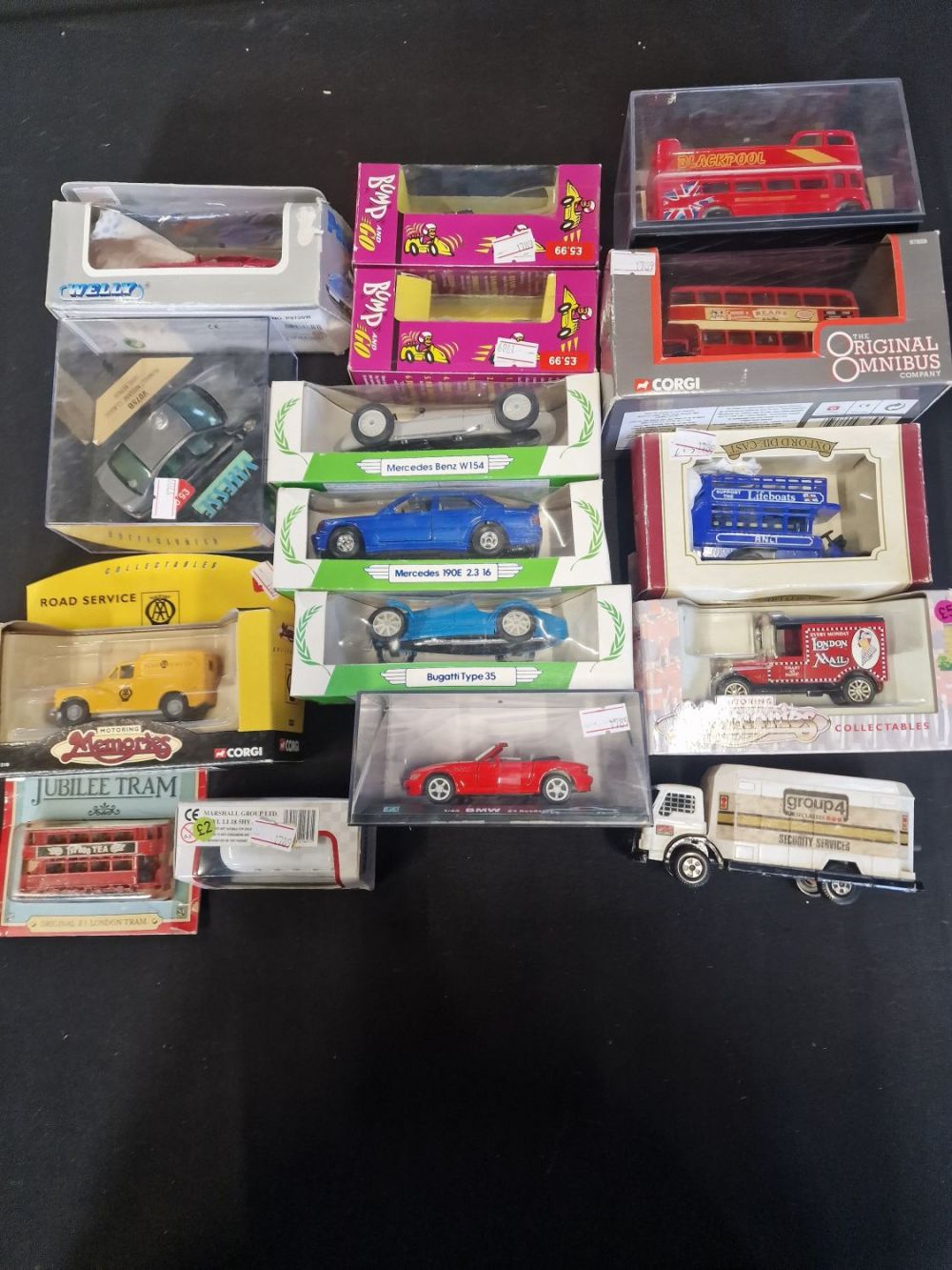 Lot 160: A collection corgi, welly and matchbox cars, trucks...