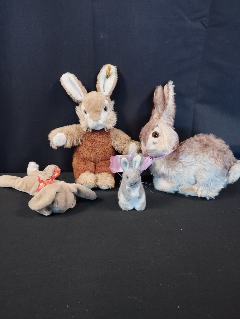 Lot 164: Four Vintage Steiff Bunnys. Inc Mohair Sleeping Rabbit,...