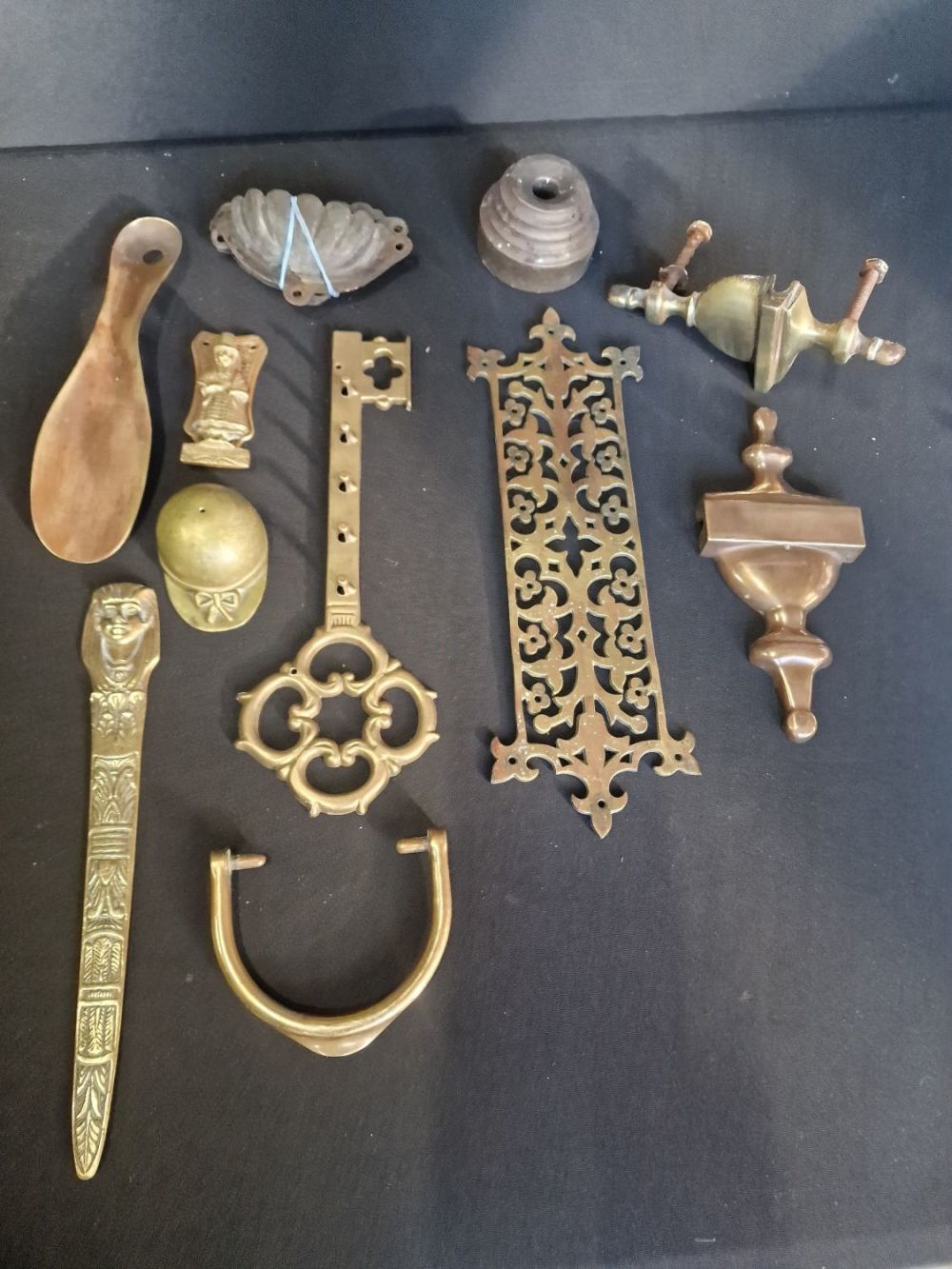 Lot 201: A collection of vintage brass items. Includes door...