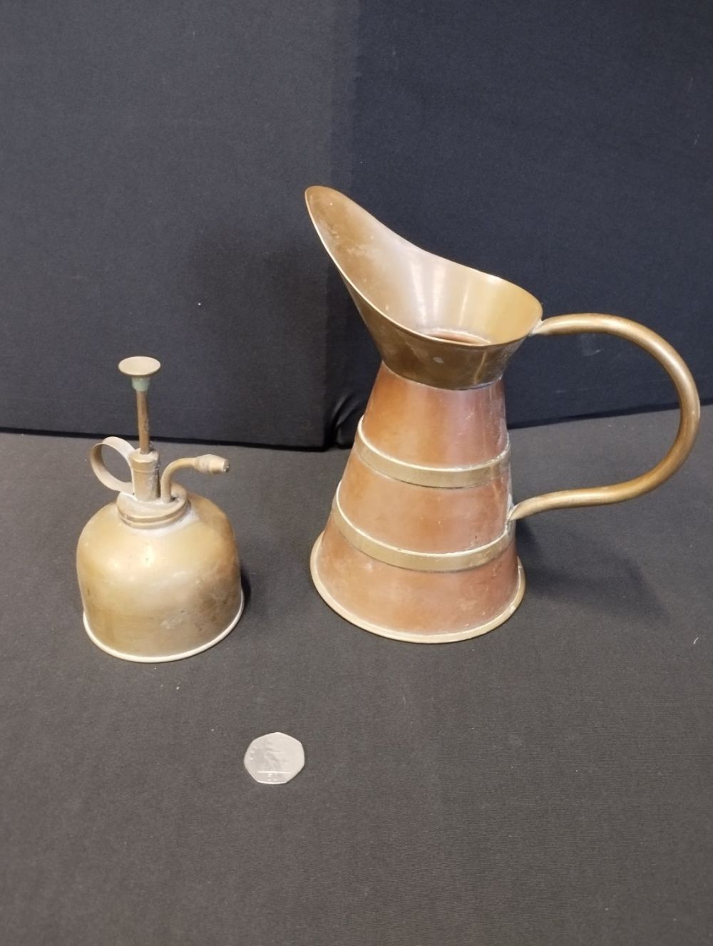 Lot 272: Vintage Brass Pump Sprayer and Jug.