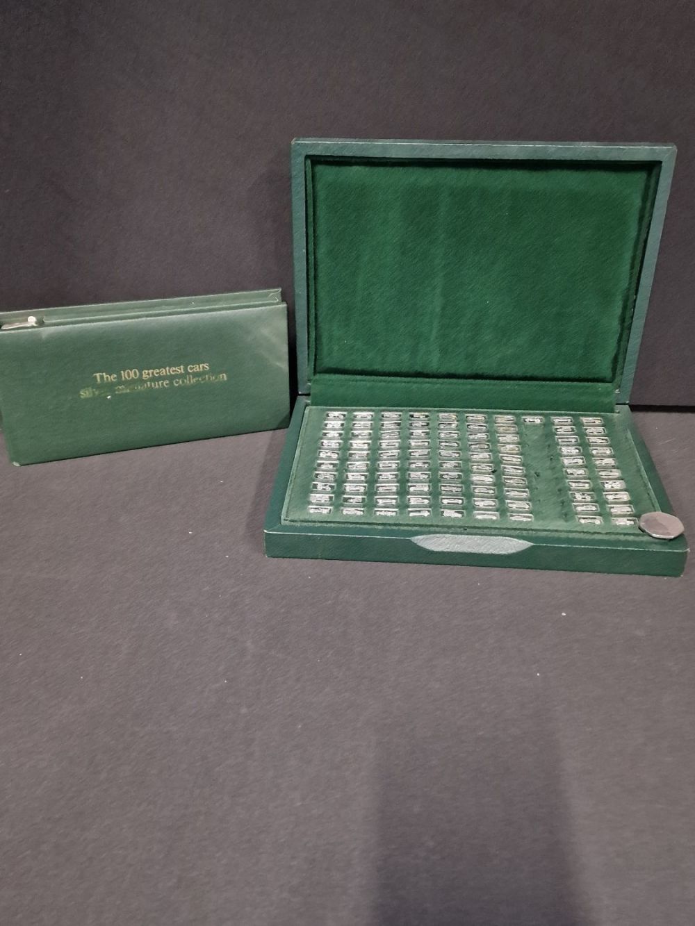 Lot 287: The 100 greatest cars. Sterling silver miniature ingots...