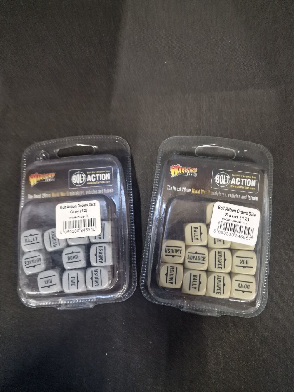 Lot 335: Bolton Action orders dice set in (12) Grey...
