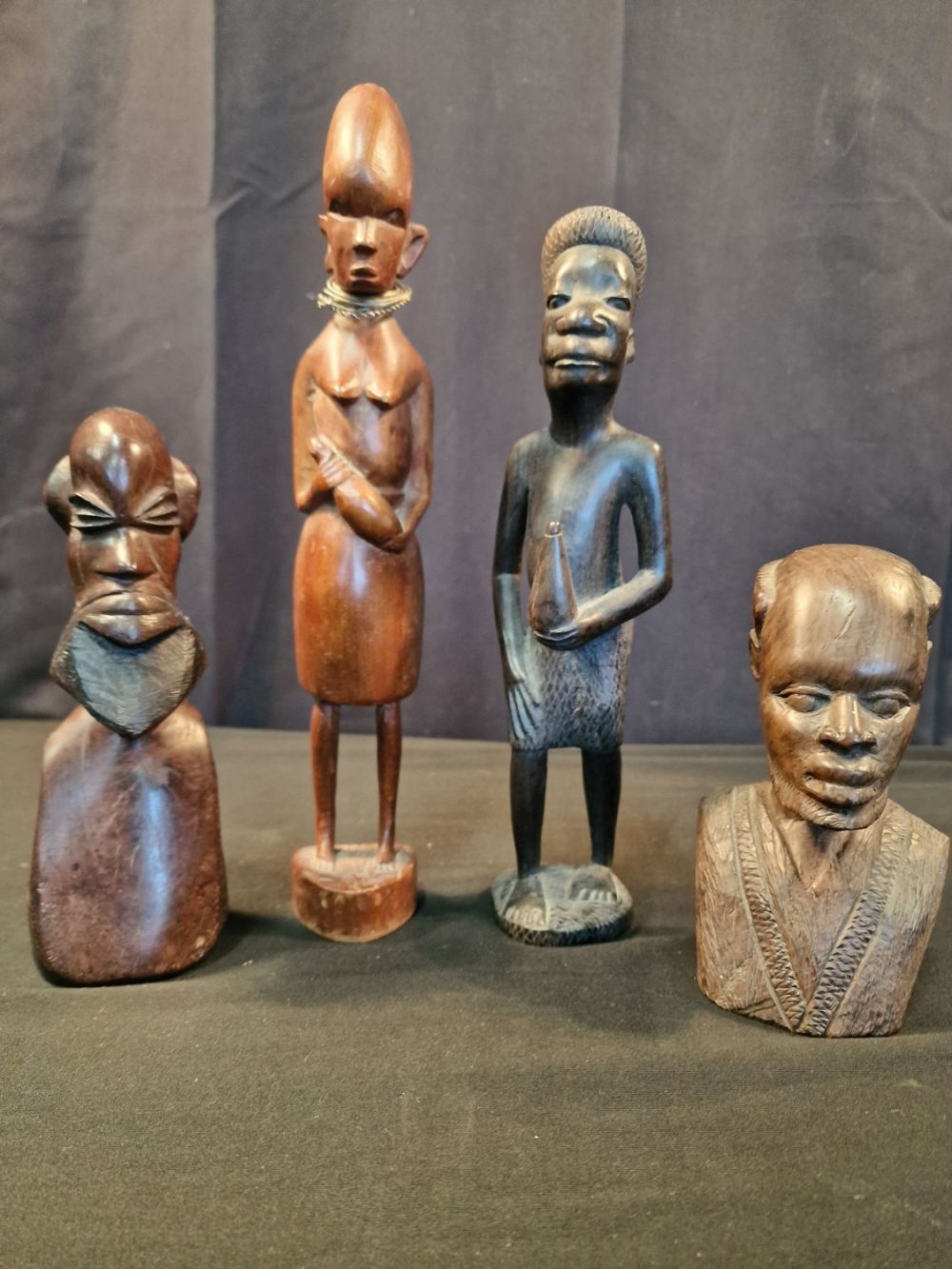 Lot 121: Four pieces of wooden Africana. Three males and...