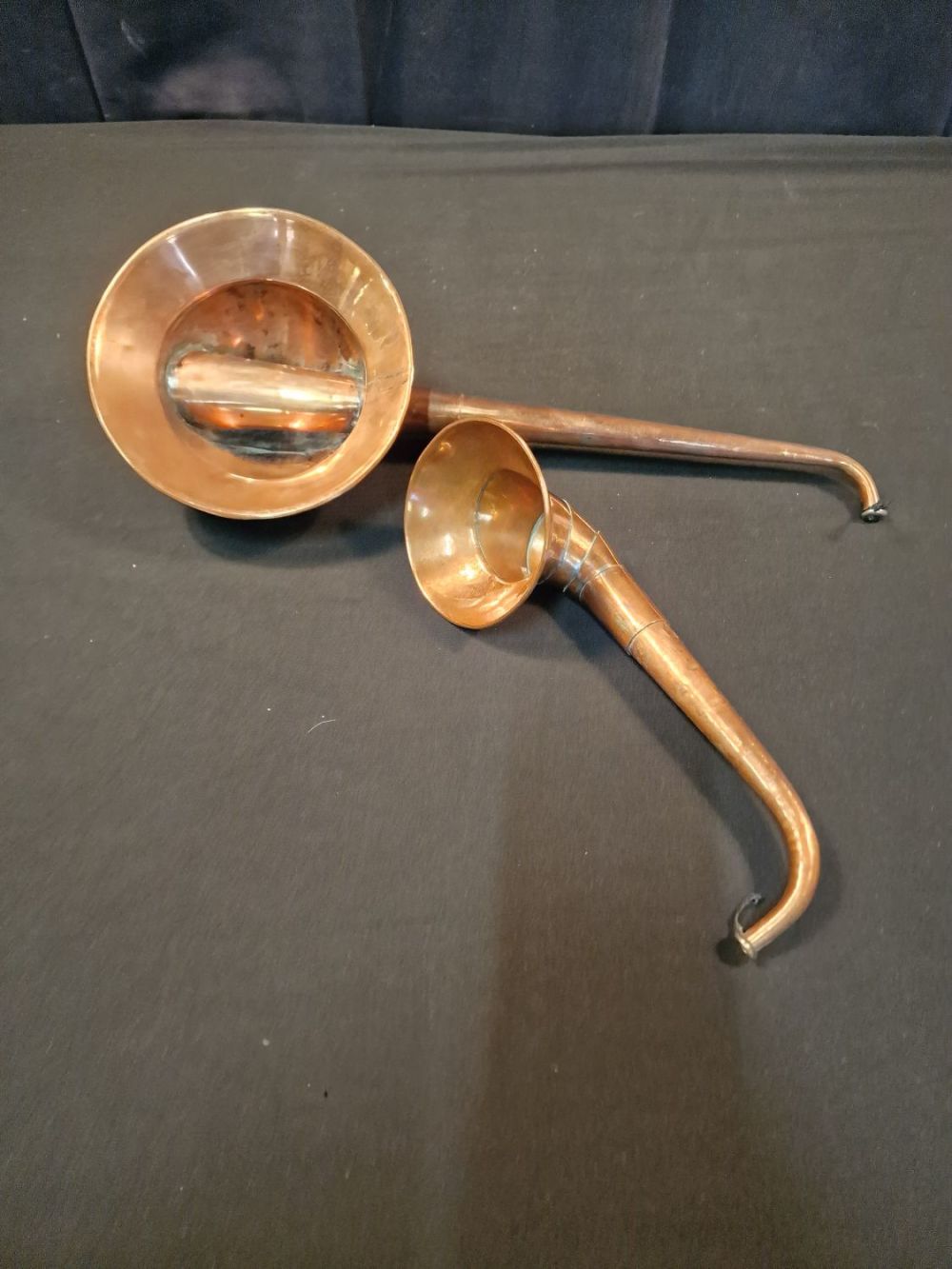 Lot 130: Two vintage copper hearing horns or hearing trumpets....