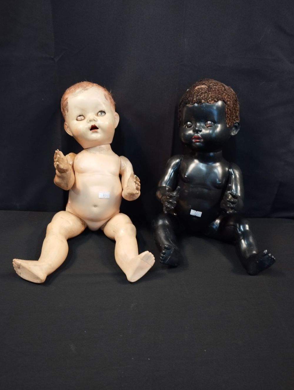 Lot 143: 1950s Vintage Hard Plastic Black and White Dolls...