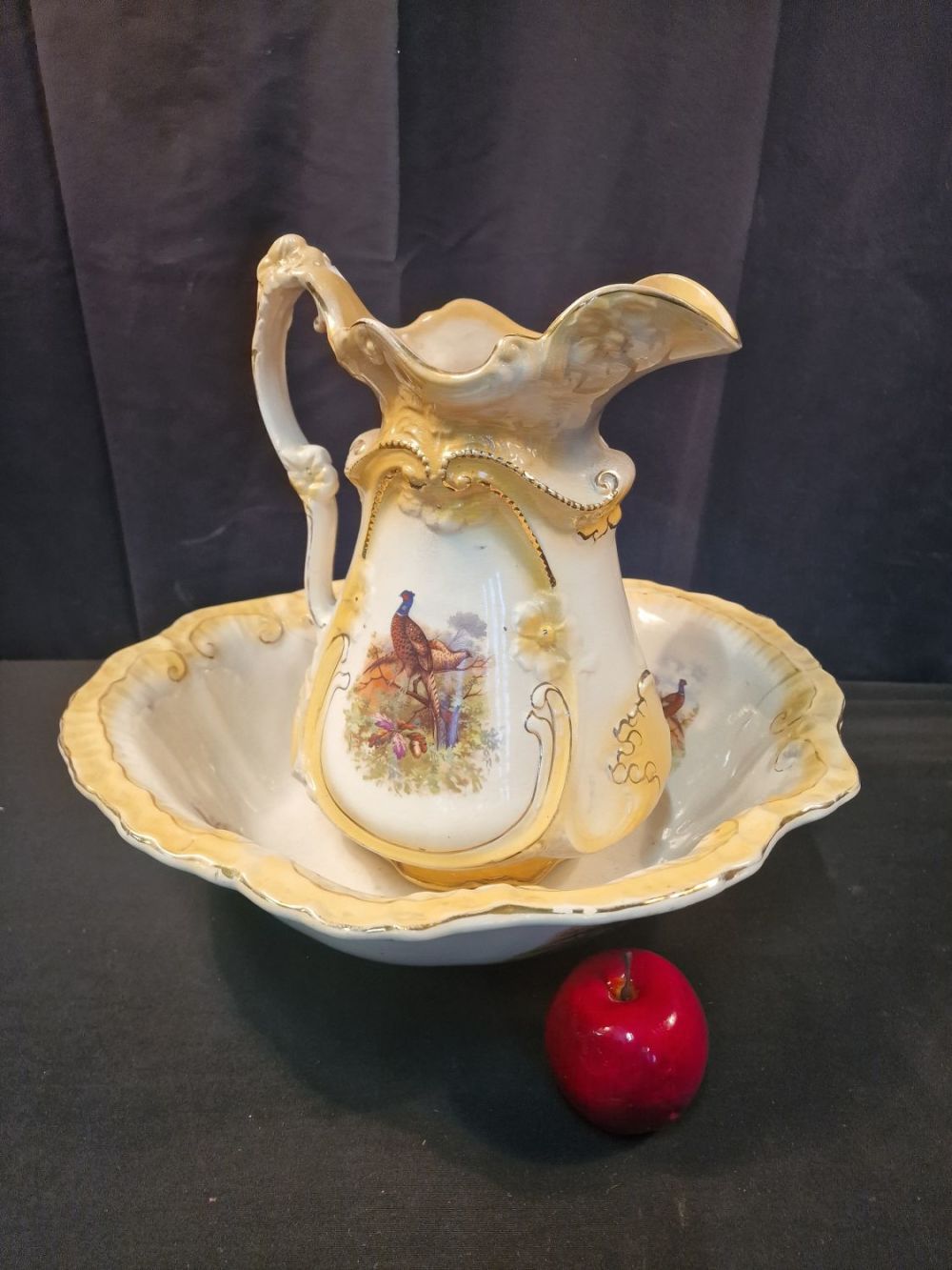 Lot 207: A ceramic porceline pitcher and wash basin bowl...