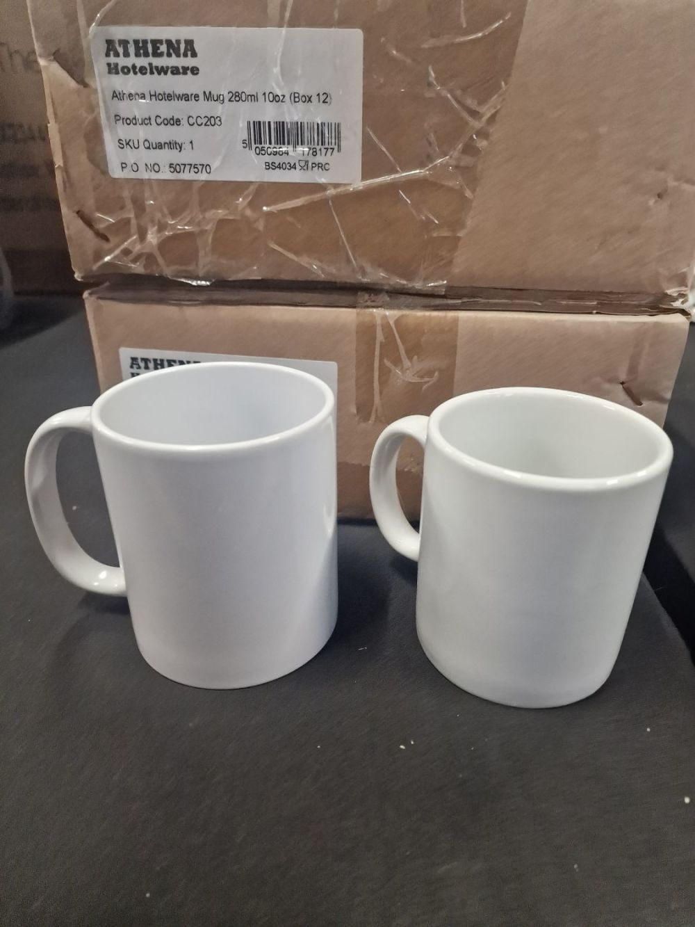 Lot 259: 26 10oz and 12oz White Brand New Mugs.