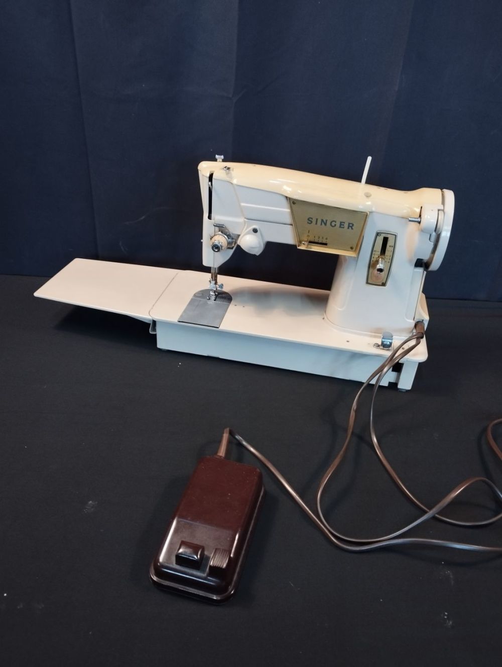 Lot 271: Vintage Singer Sewing Machine in Leather Carry Bag....