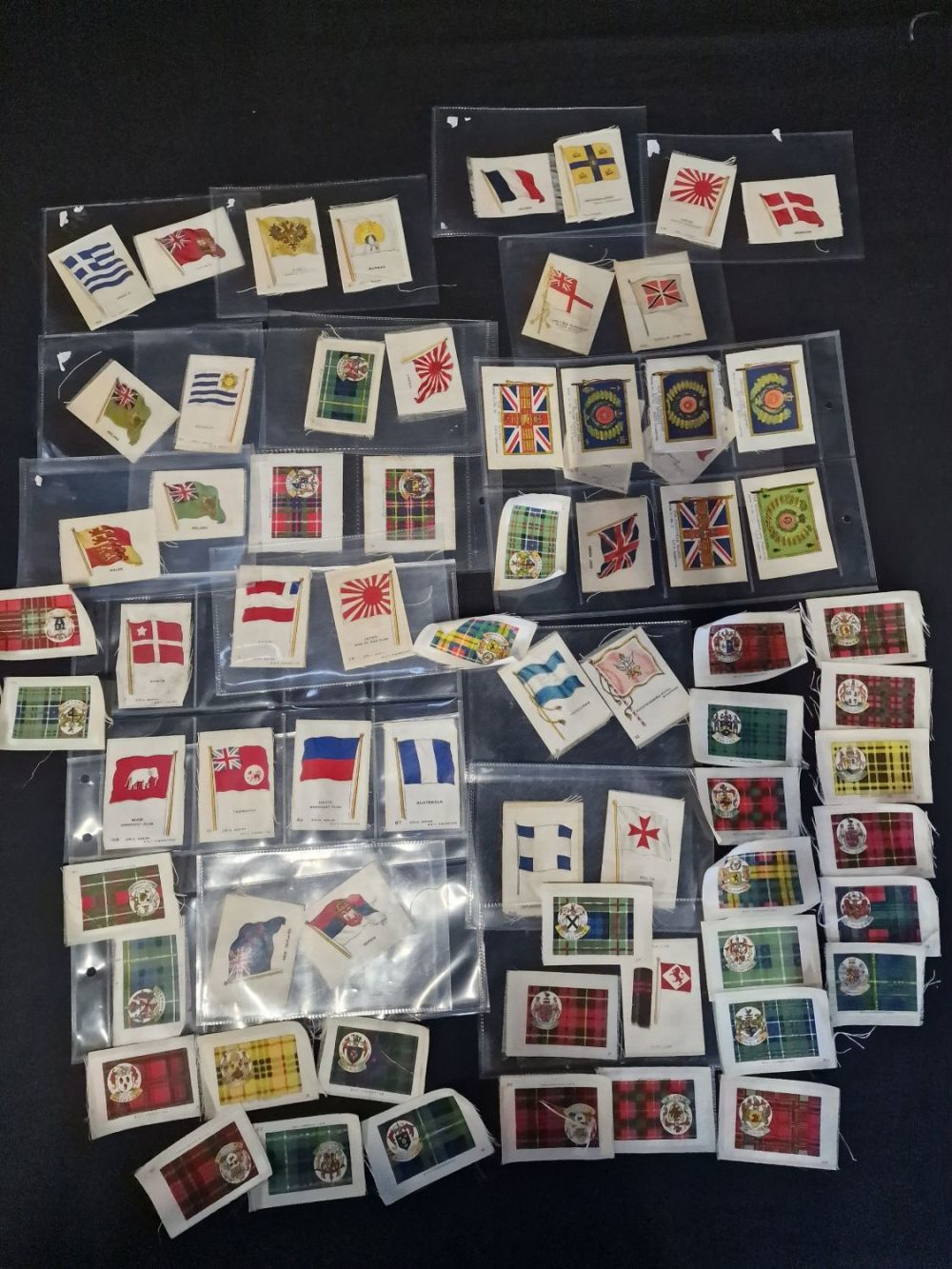 Lot 300: A large collection of cigarette silks. Flags and...