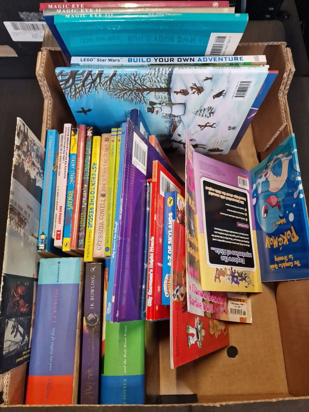 Lot 333: A collection of children's books includes Harry Potter,...