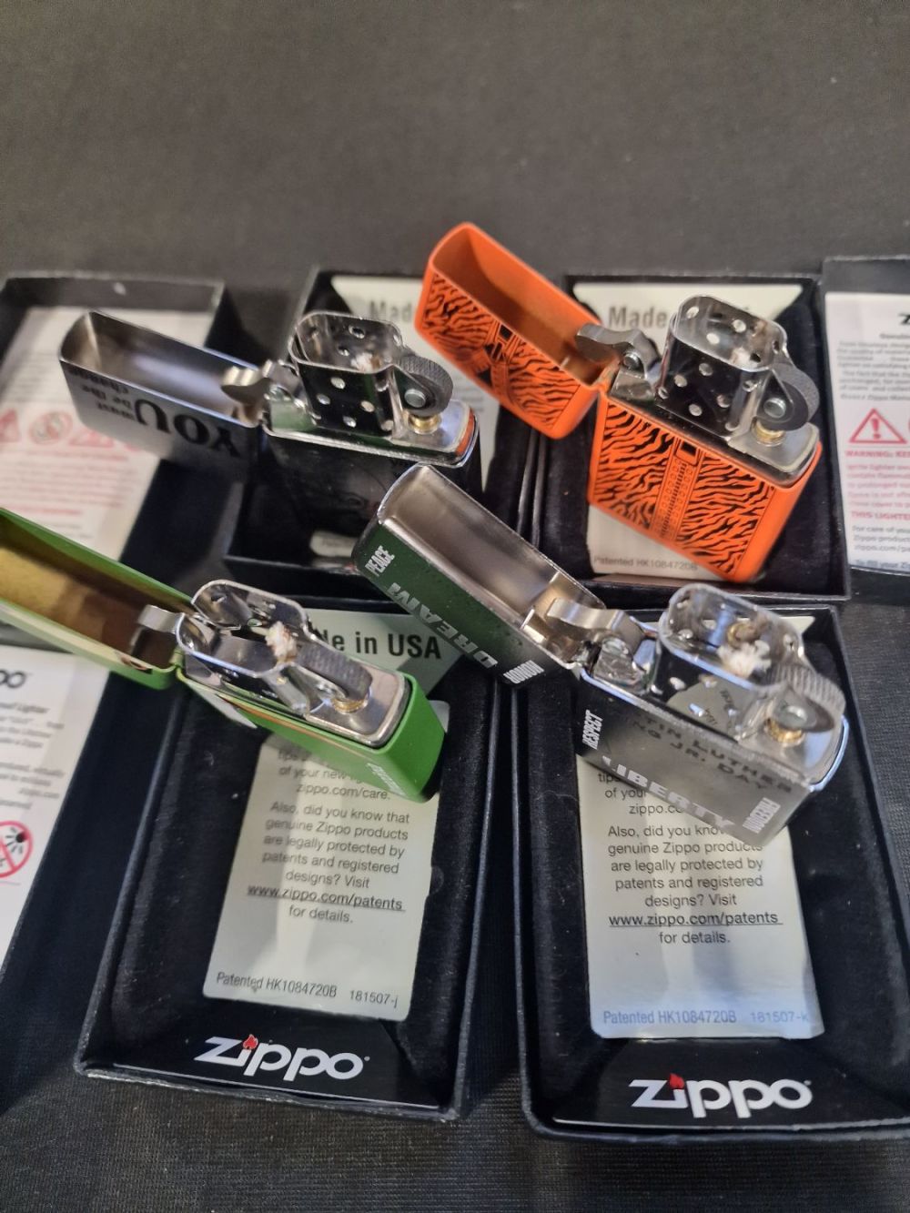 Lot 375: Four Zippo lighters all new unused and boxed...