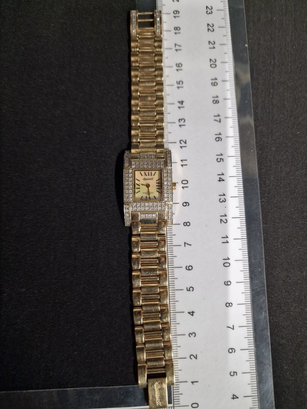 Lot 387: Ladies Ingasol diamond watch with gold finish strap....