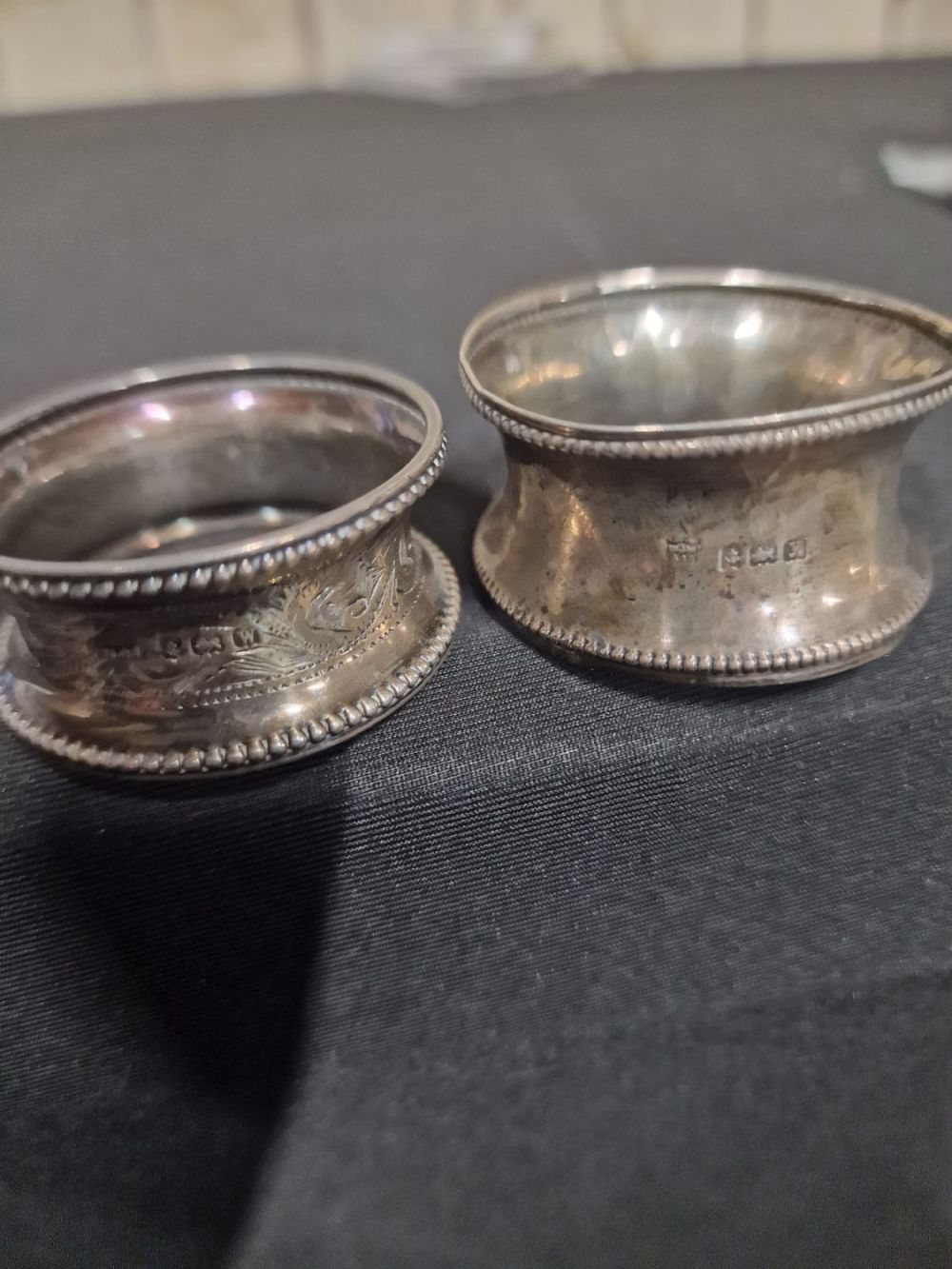 Lot 390: Two sterling silver napkin rings Birmingham hallmarks. 14.7g...