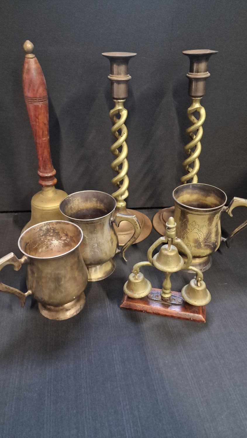 Lot 70: A collection of brass items includes Twist candle...