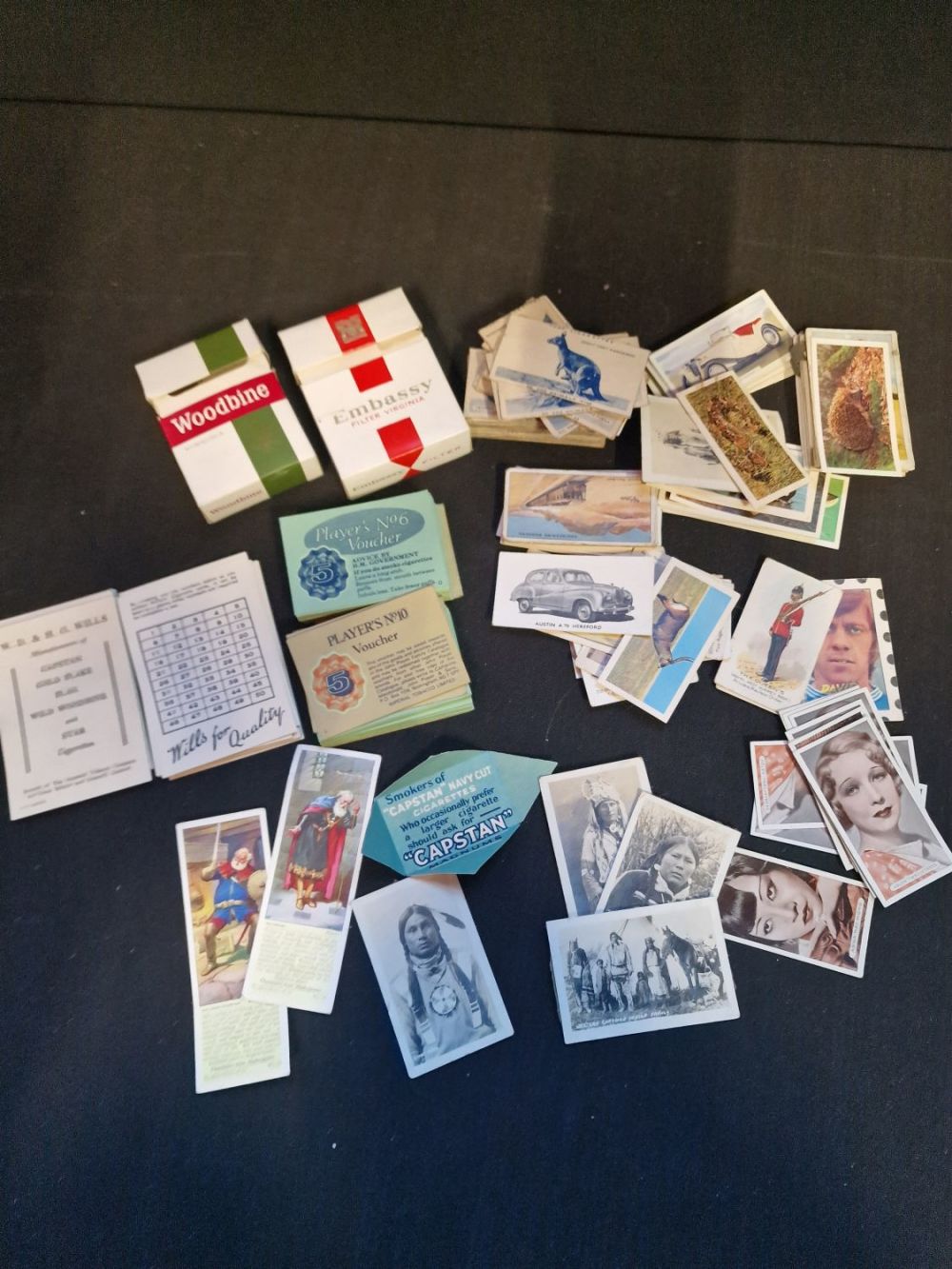 Lot 132: A collection of vintage cigarette memorabilia. Includes Woodbine...