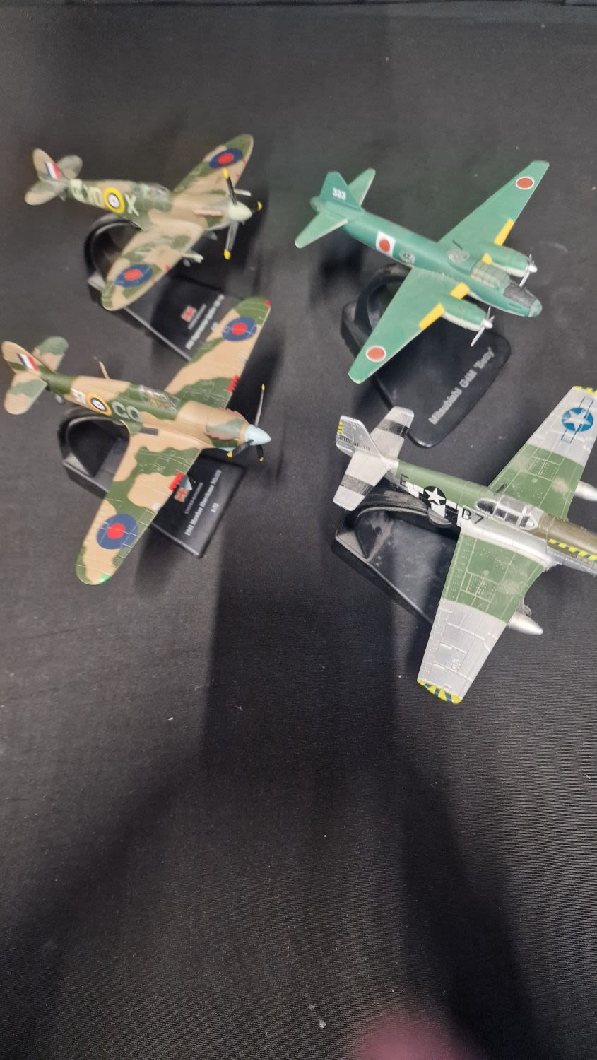Lot 57: Four AMER Collection collectable planes.