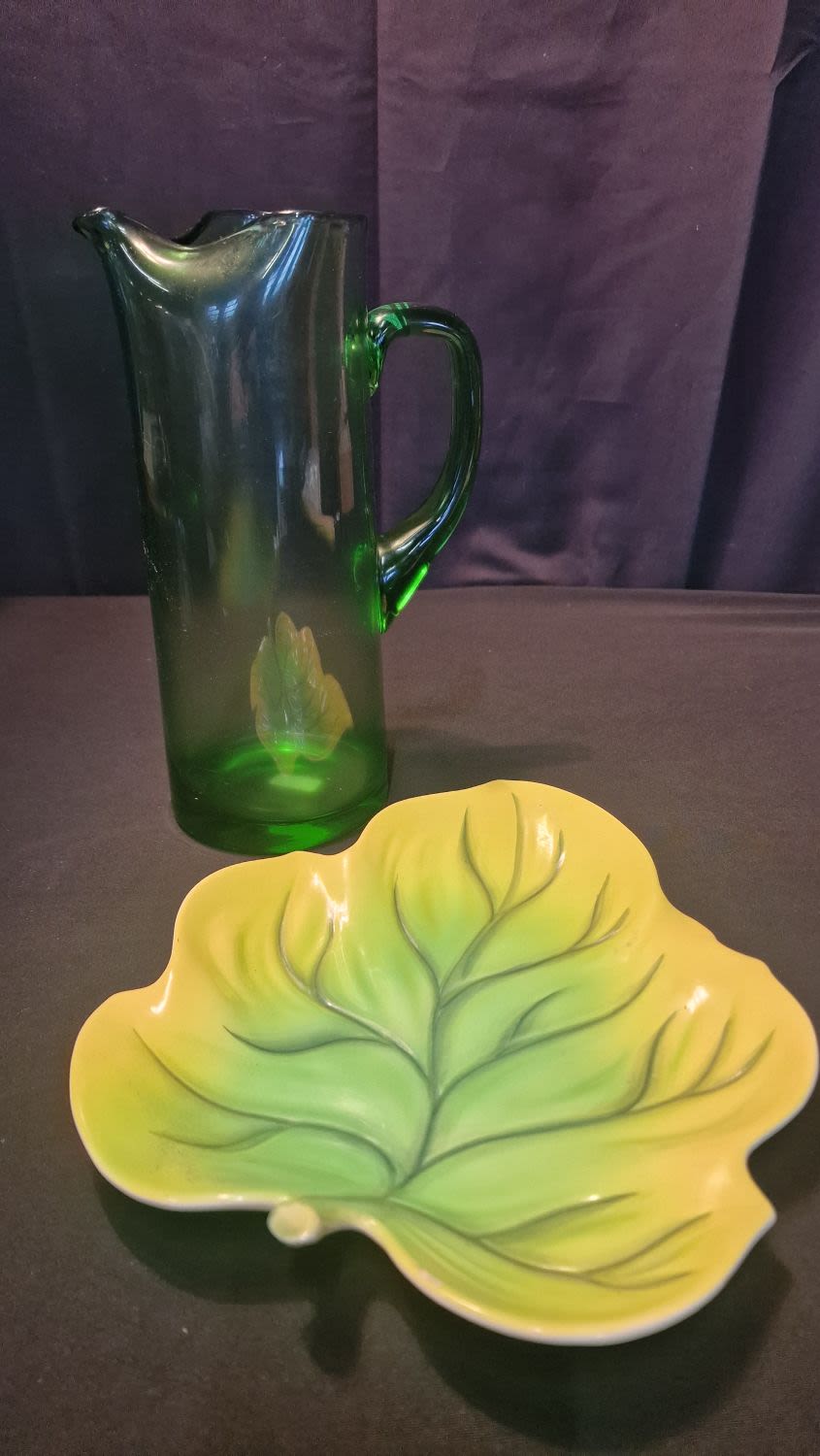 Lot 62: Hand blown studio style glass green pitcher /...