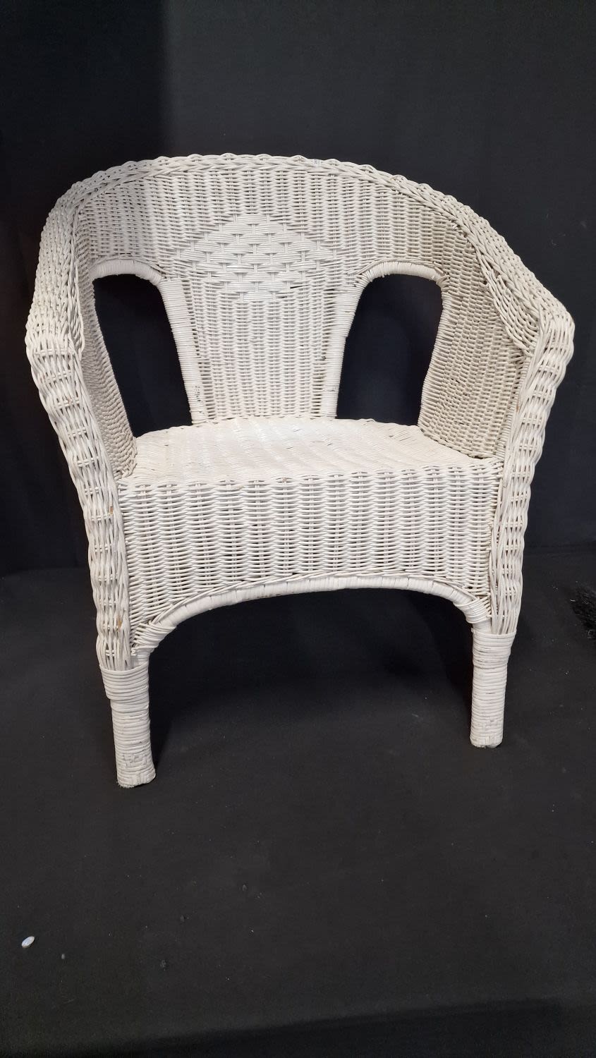 Lot 82: A rattan tub chair in white