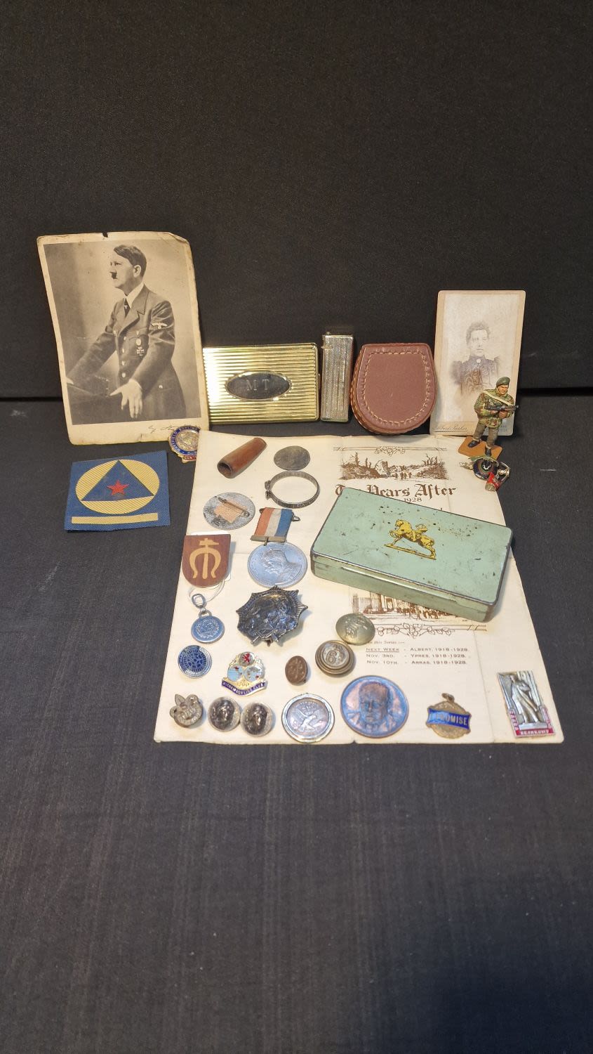 Lot 88: A collection of vintage items including Militaria, pins,...