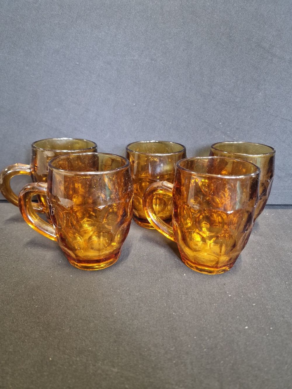 Lot 254: Five vintage amber glass half pint glasses