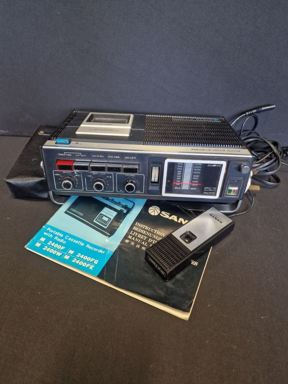 Lot 256: SANYO portable cassette recorder with radio and remote.