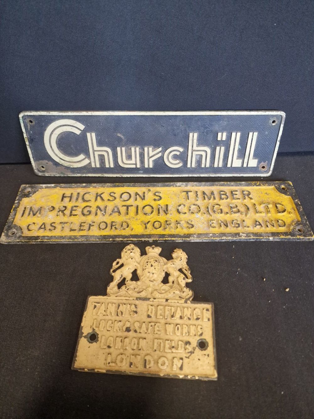 Lot 270: Three cast iron signs. Churchill, Hicksons timber impregnation...