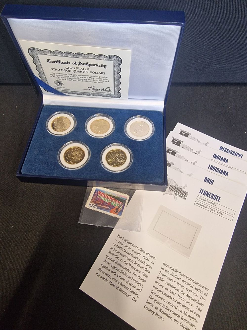 Lot 273: Five 2001 statehood 24ct gold plated quater dollars....