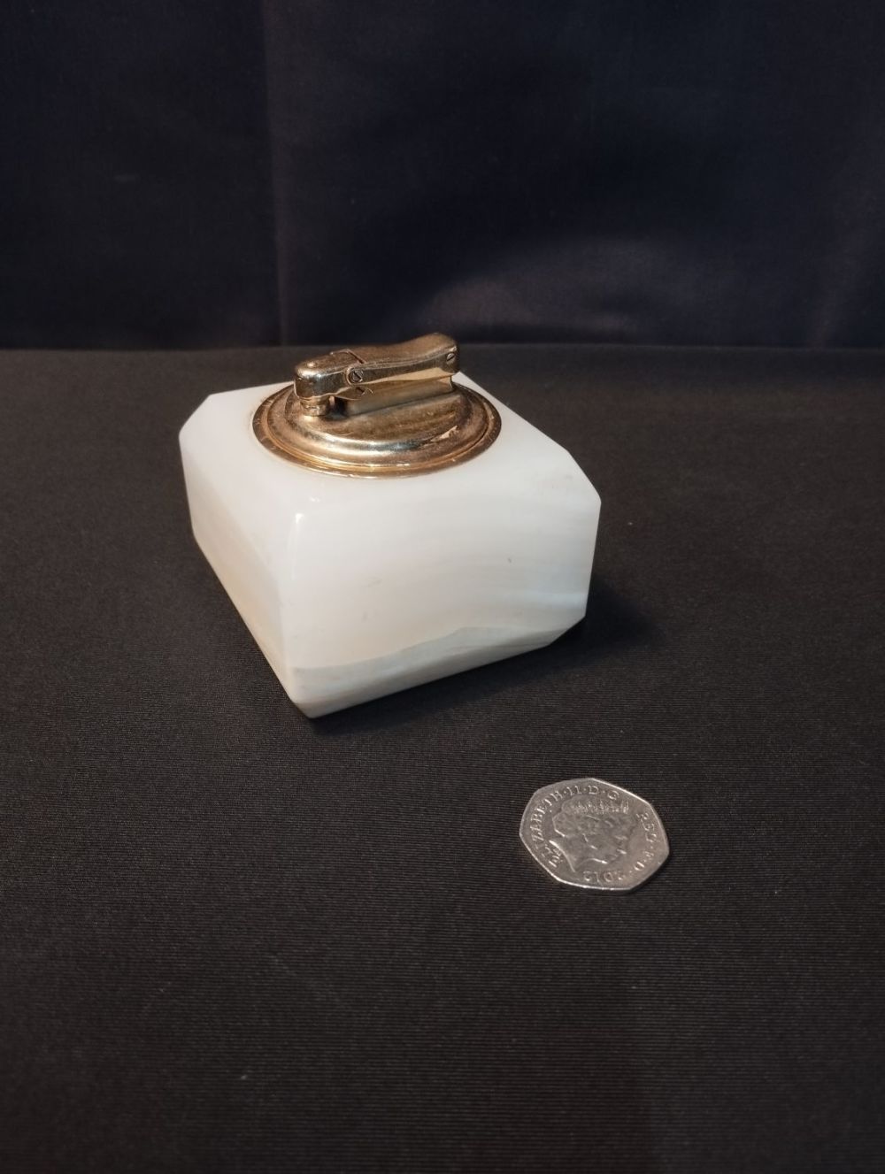 Lot 294: A Vintage Colibri Table Lighter with Onyx Base