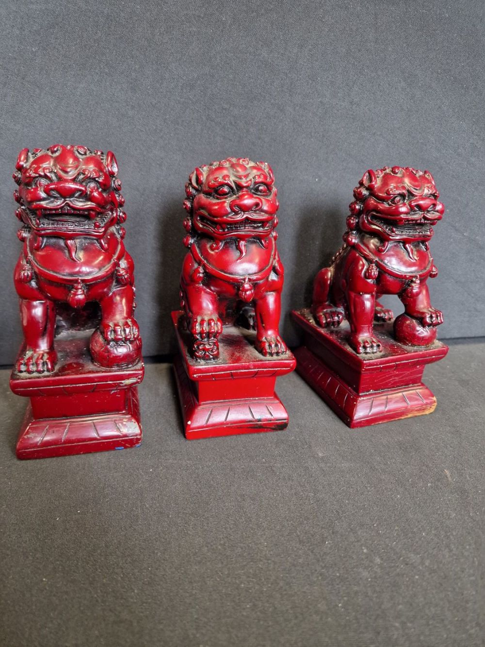 Lot 310: Three heavy 7" Chinese Fu Dogs.